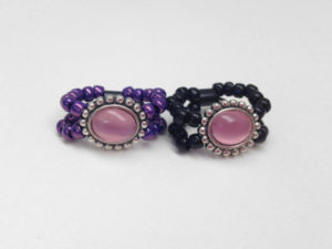 the mauve amulet rings